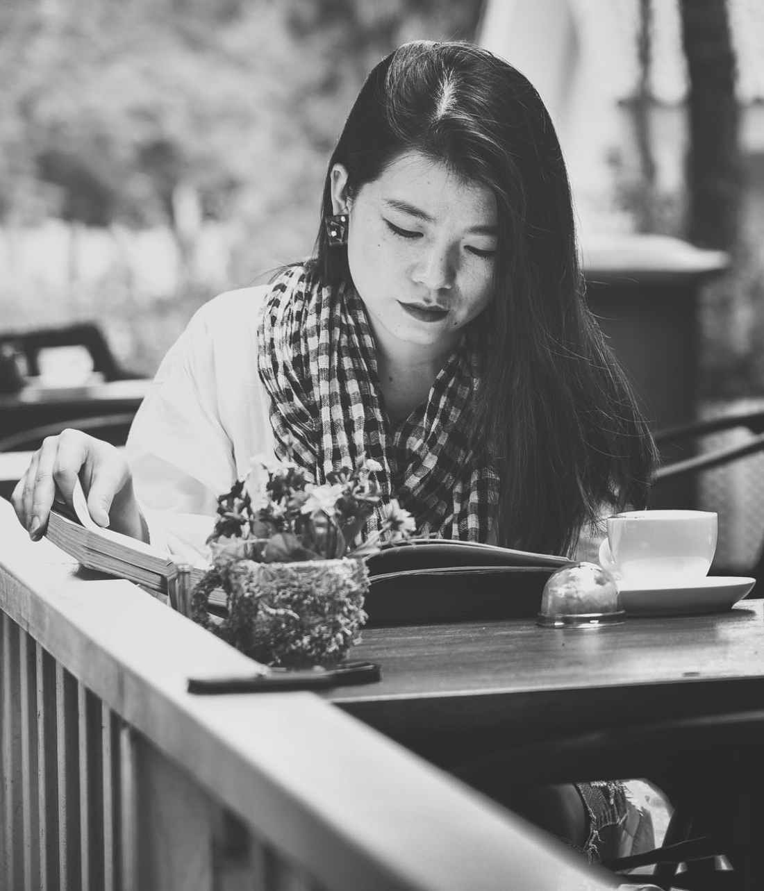 grayscale photography of woman reading